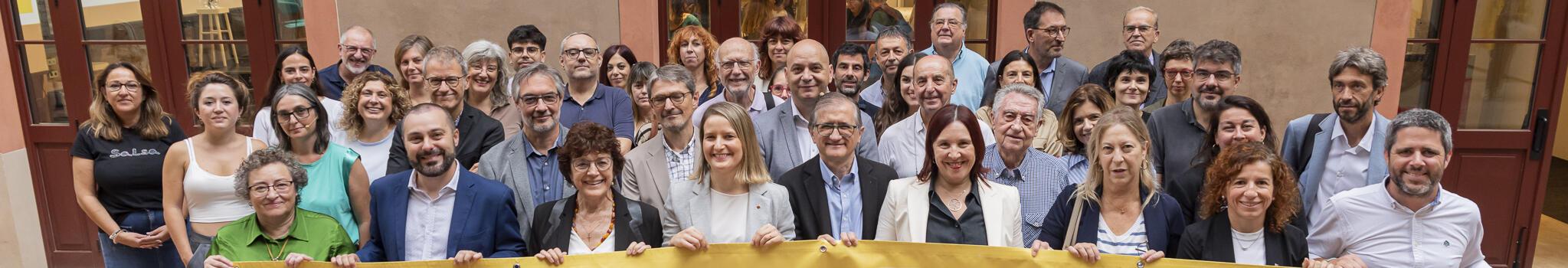 Imatge de la foto institucional de l'acte del Dia de la Pobresa de la Taula sobre pobresa i desigualtats territorials al Hub Social