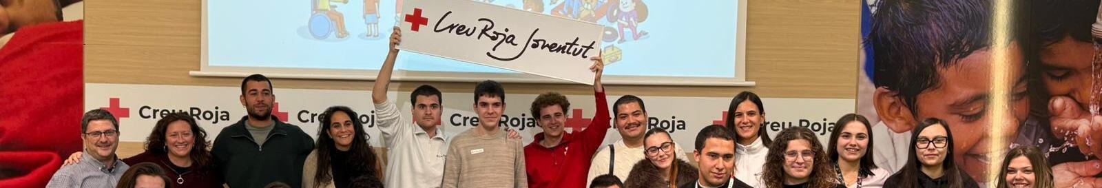 Imatge d'un grup de joves de Creu Roja Joventut promovent la campanya Els seus drets en joc